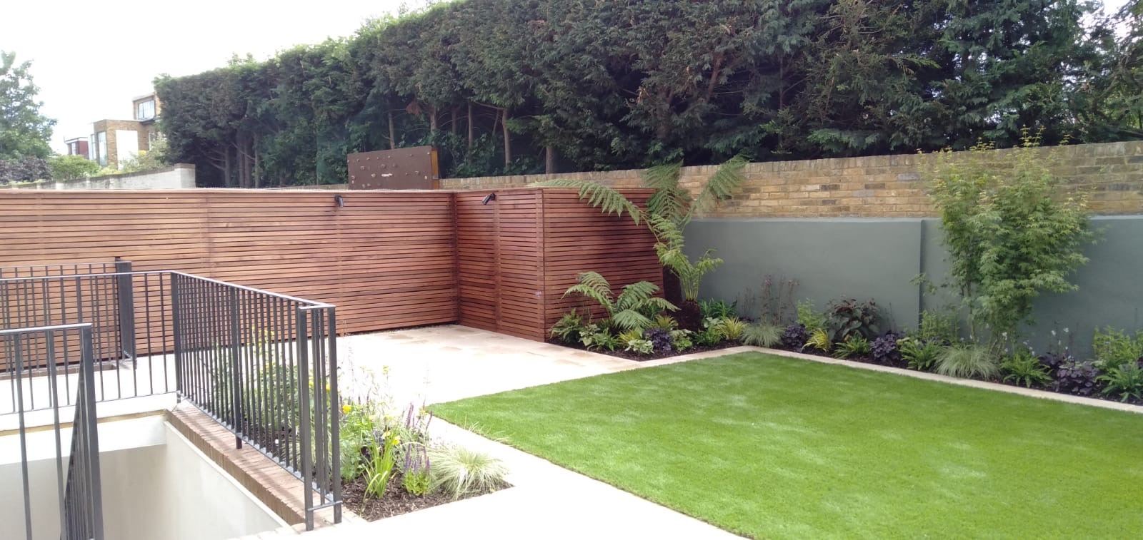 Rear garden in Ealing AS landscapes